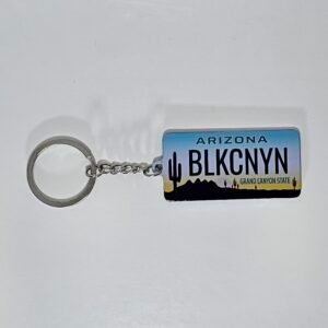 Arizona BLKCNYN license plate keychain with desert sunset and cactus silhouettes